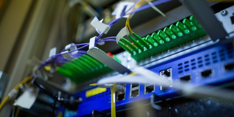 Showing,Flat,Design,Fiber,Patch,Panel,With,Green,Adapters,And